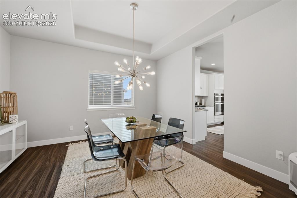 Image 9 of 31: The main level living room with vaulted ceilings and tons of natural lighti