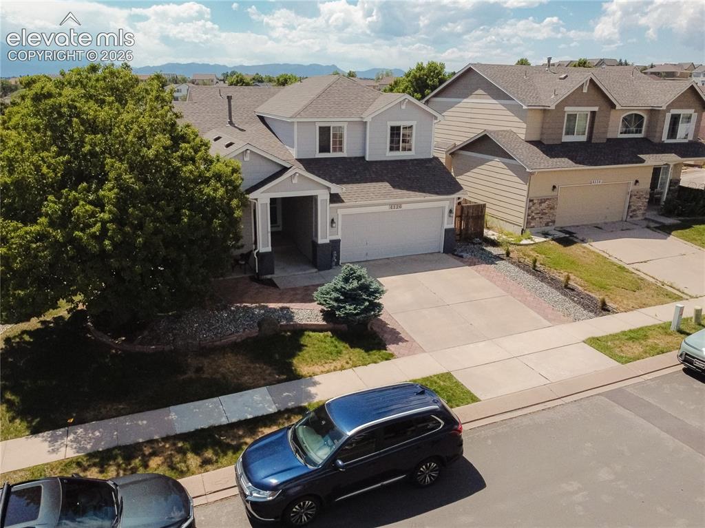 Image 45 of 48: Two-story residence featuring a covered front entry and a two-car garage