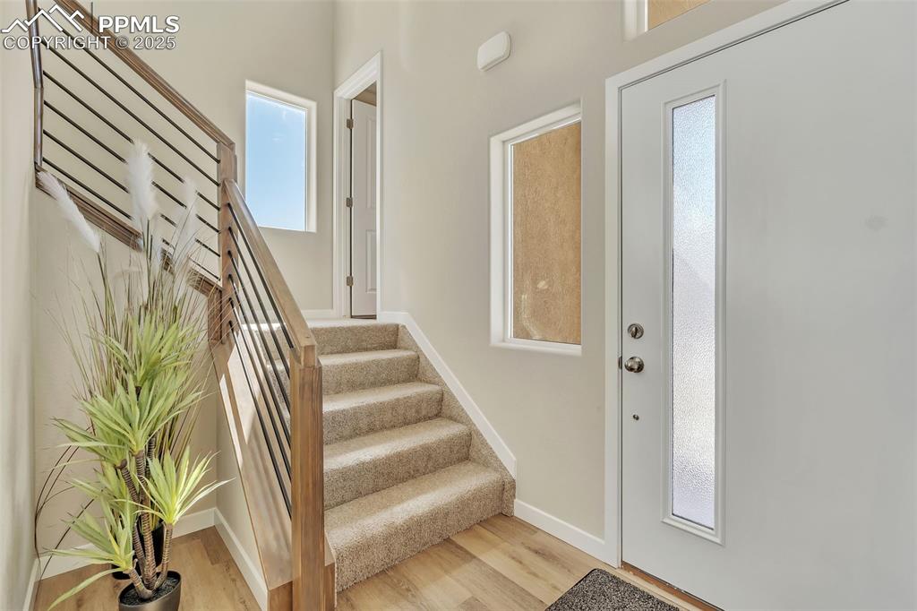 Image 6 of 46: Entryway featuring light wood-style floors and stairway