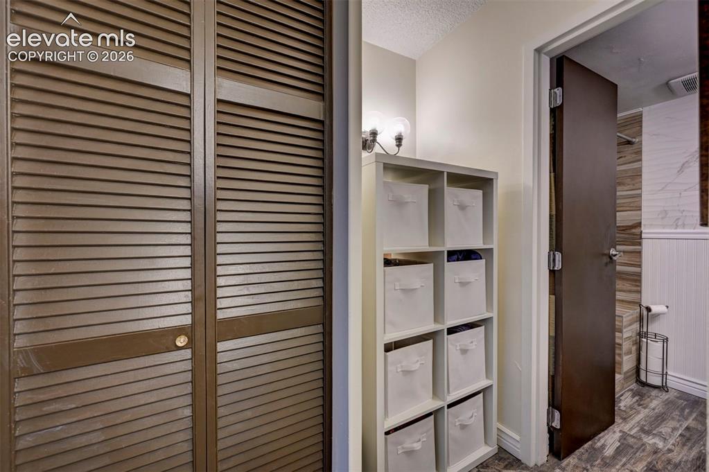 Image 18 of 33: Hall closet + Additional storage area