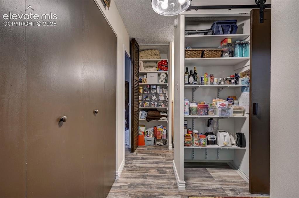 Image 22 of 33: Storage! Clothing Closet, Kitchen Pantry, & Hall Closet