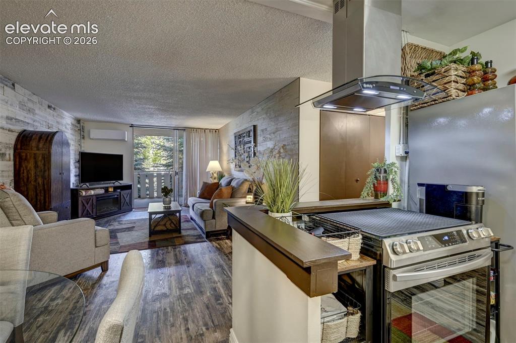 Image 3 of 33: Kitchen opens to Living Room