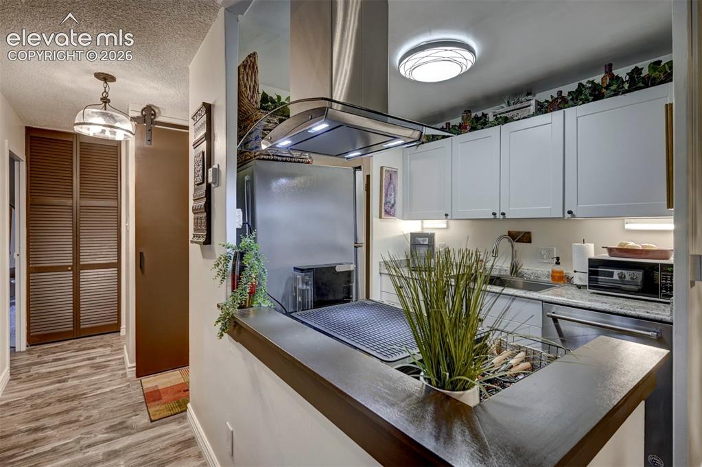 Image 4 of 33: SS Appliances and Pantry