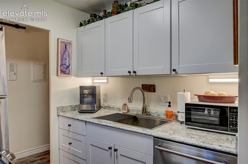 Image 6 of 33: Updated Cabinets. Granite Counters