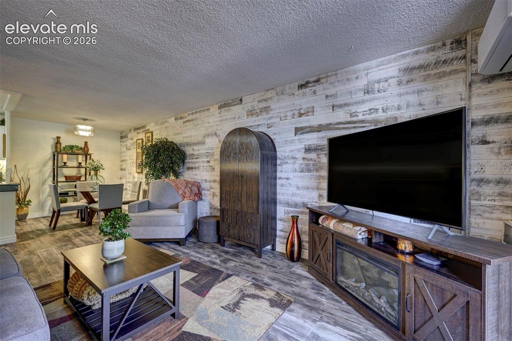 Image 9 of 33: Living /Dining area-Reclaimed Wood Wall