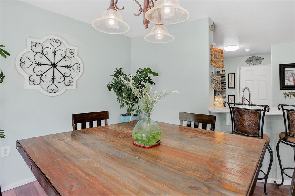 Image 10 of 42: main level living with dining and walk out 