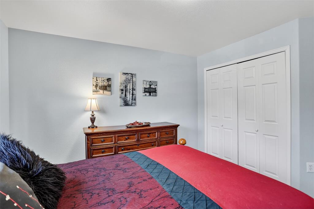 Image 18 of 42: he upper level features two spacious bedrooms, a laundry area, and a genero
