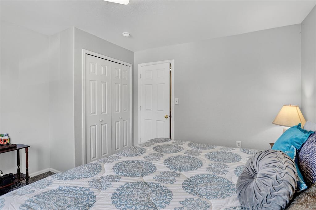 Image 22 of 42: he upper level features two spacious bedrooms, a laundry area, and a genero
