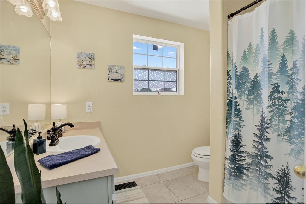 Image 27 of 42: he upper level features two spacious bedrooms, a laundry area, and a genero