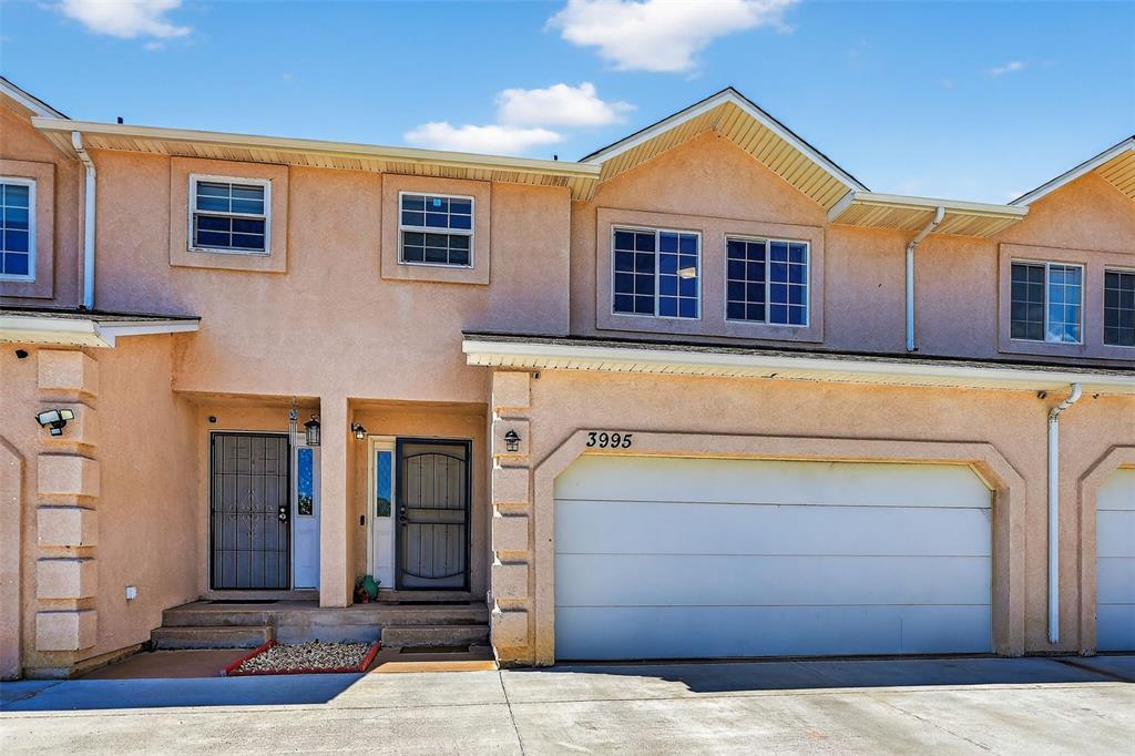 Image 3 of 42: Two car garage, stucco exterior - 2-story home in the heart of town—perfect