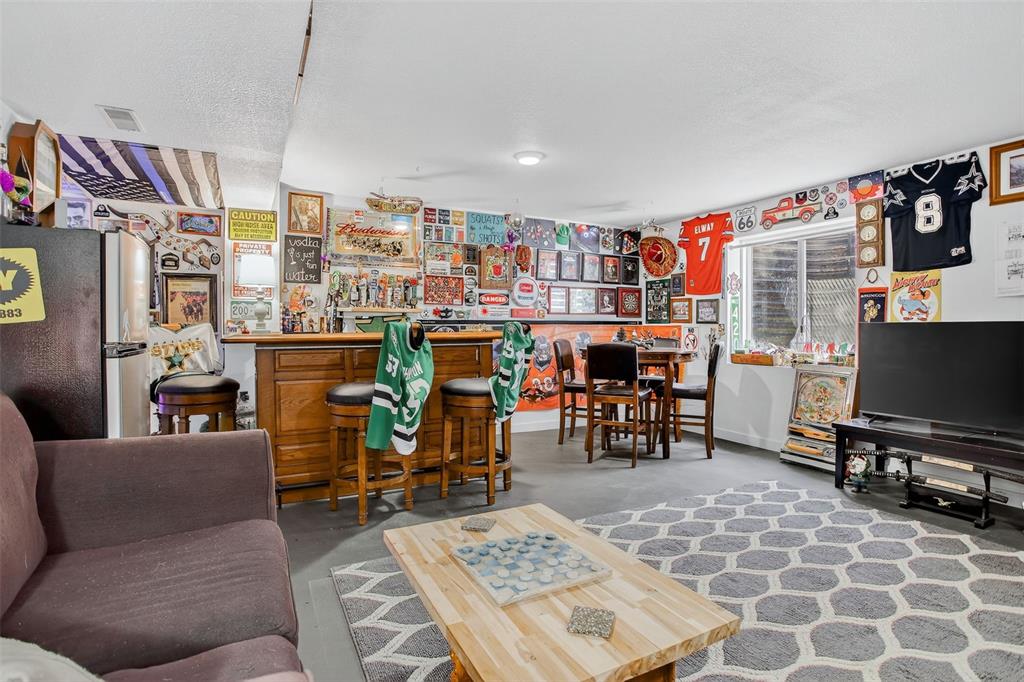 Image 30 of 42: The finished lower level adds exceptional versatility—perfect for a rec roo