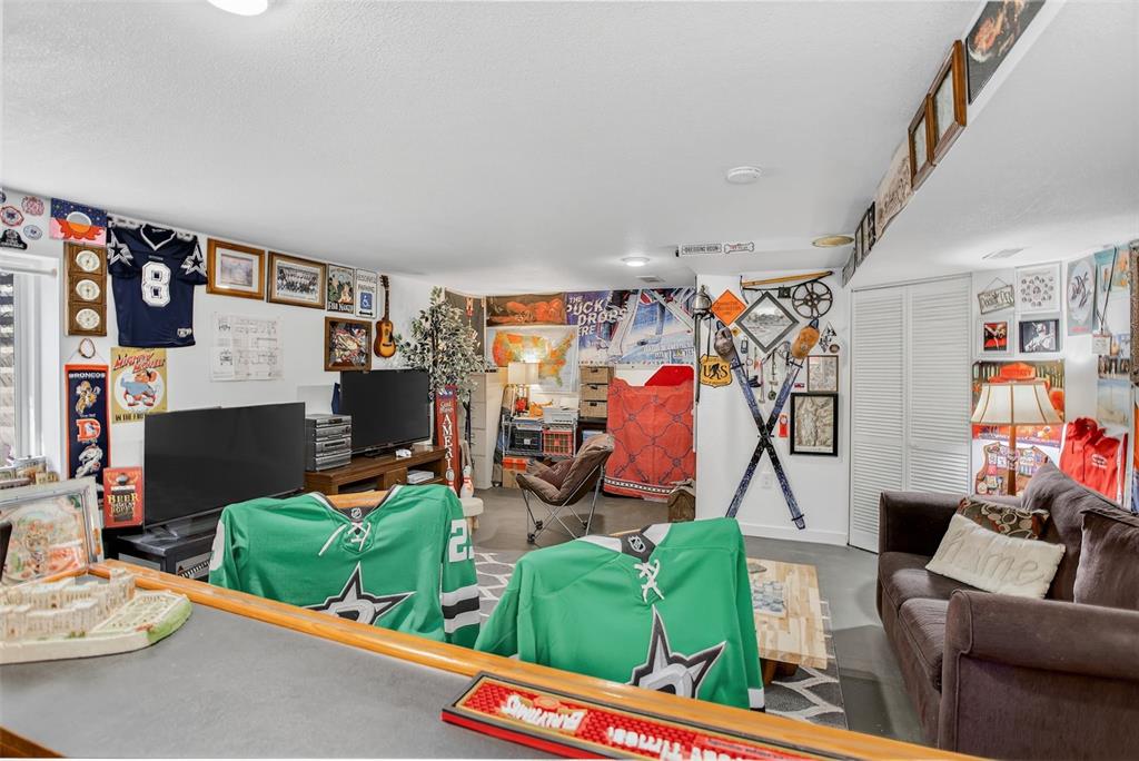 Image 32 of 42: The finished lower level adds exceptional versatility—perfect for a rec roo