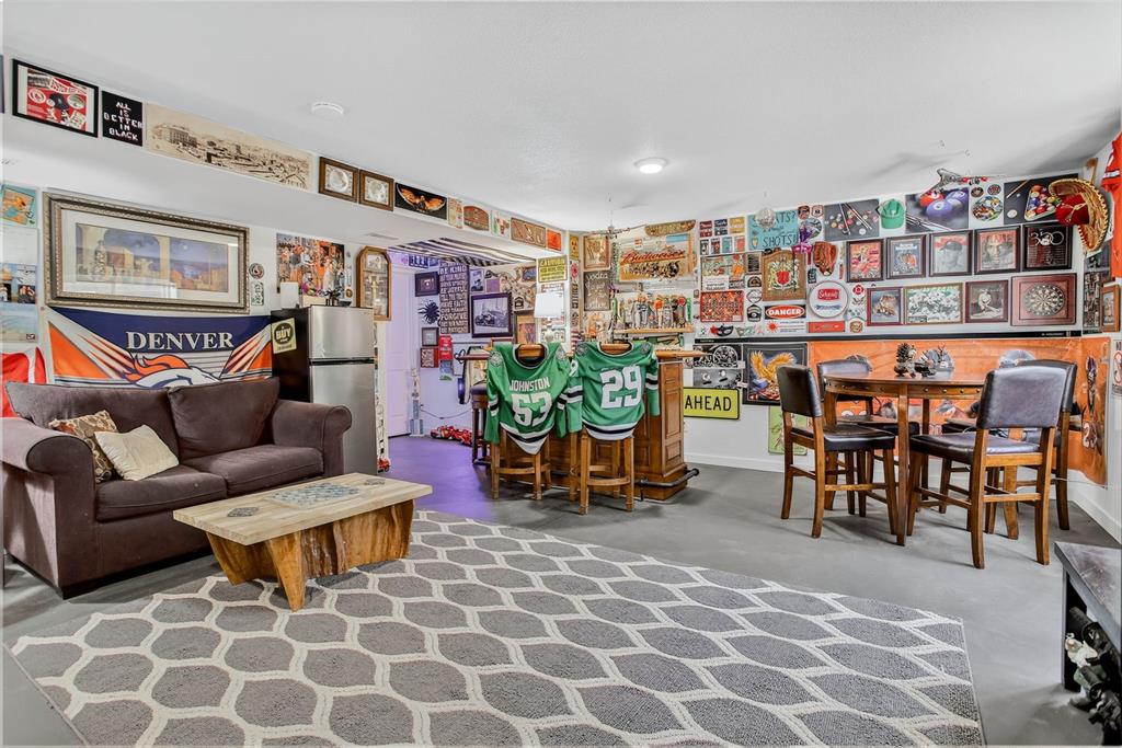 Image 36 of 42: The finished lower level adds exceptional versatility—perfect for a rec roo