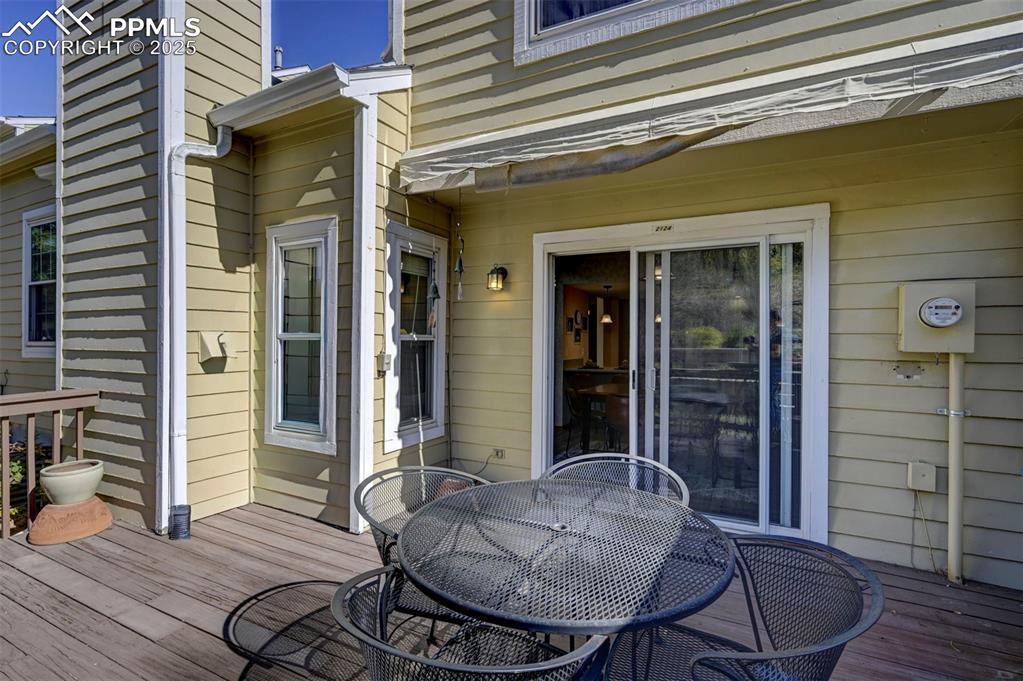 Image 10 of 43: Deck w/ Retractable Awning