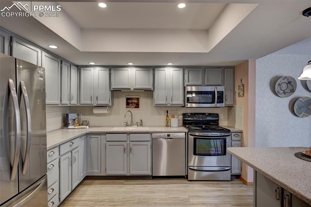 Image 15 of 43: Corian Counters, Updated Appliances, and so many Cabinets!