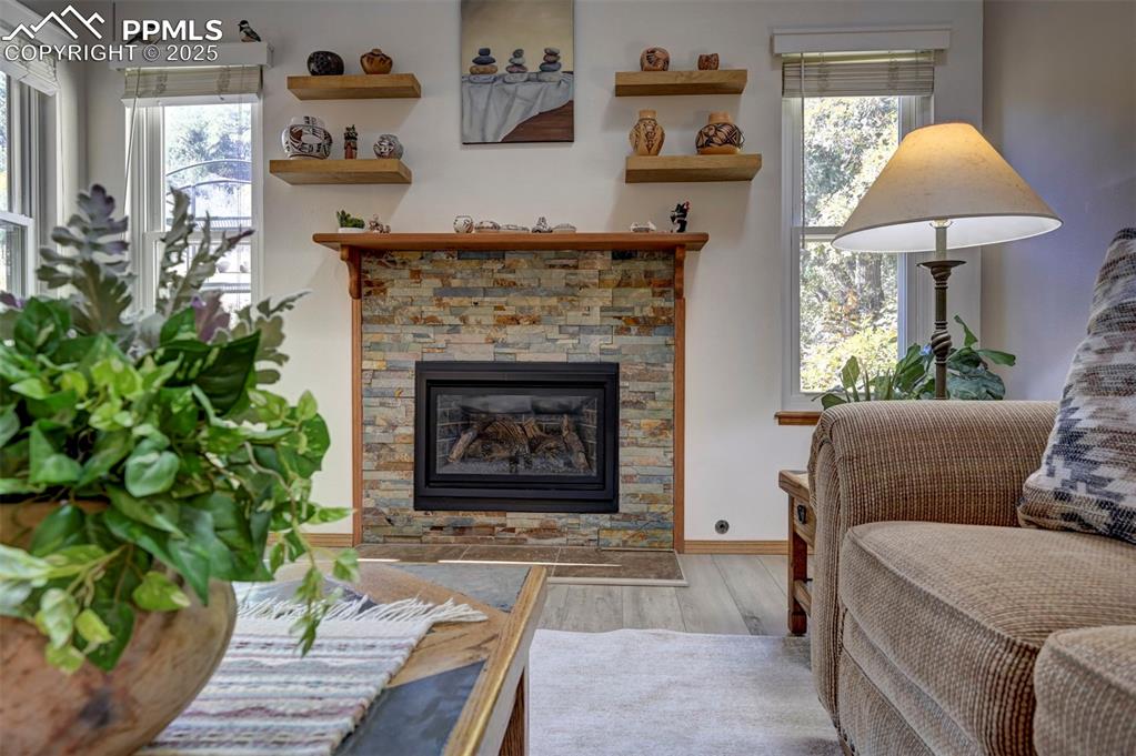 Image 4 of 43: Gas Fireplace w/ Wood Mantle & Shelving