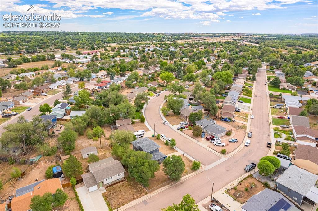 Image 40 of 43: Neighborhood setting featuring established residences and mature trees
