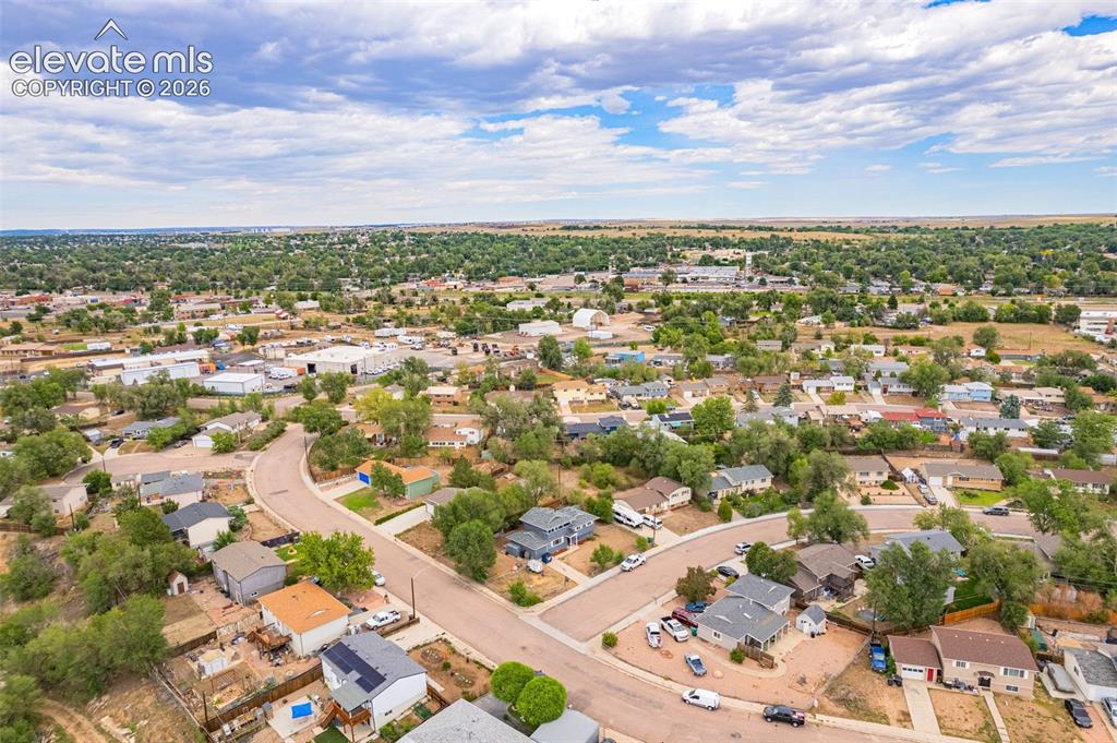 Image 43 of 43: Residential neighborhood with mature trees and paved streets