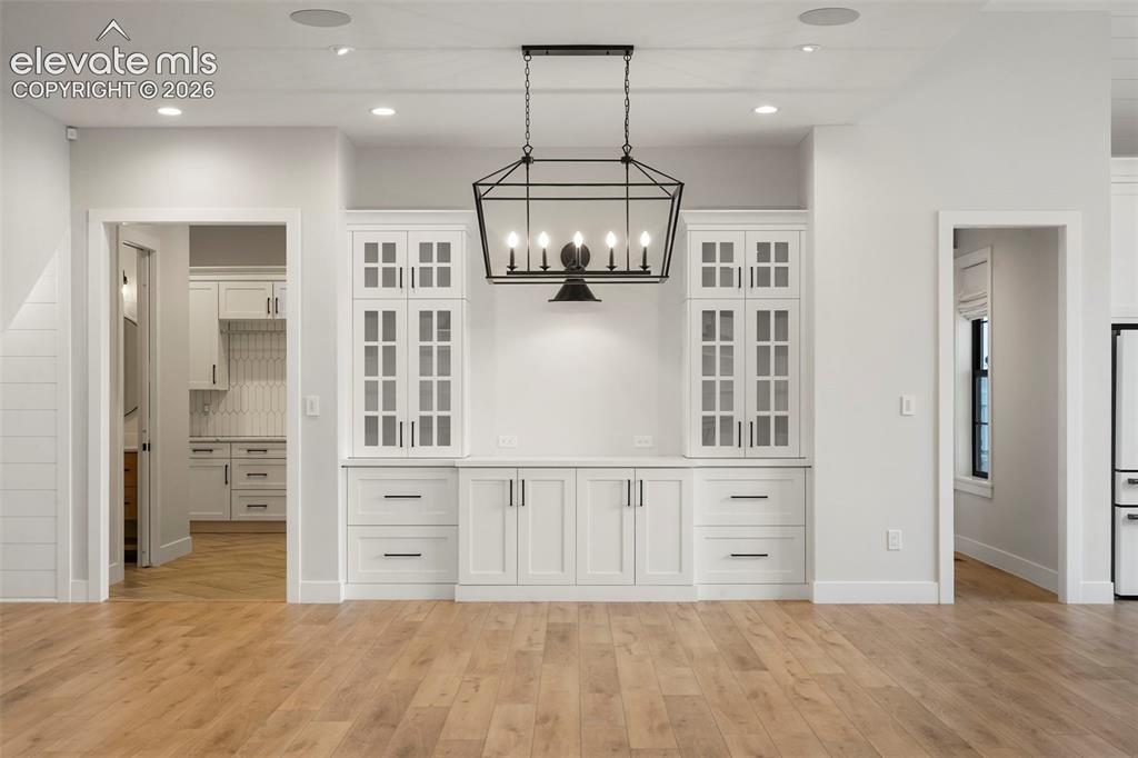 Image 13 of 49: Alternate view of the living room/great room with walk-out to patio.