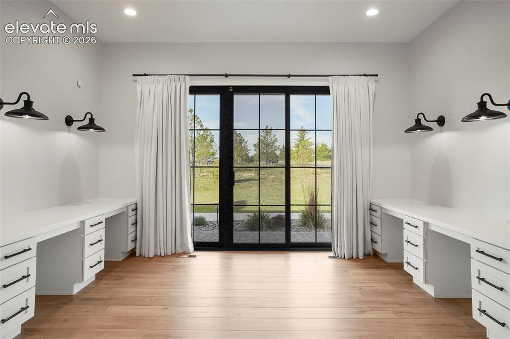 Image 14 of 49: Rich built-in cabinetry elevate the dining area. Both useful and classic. V