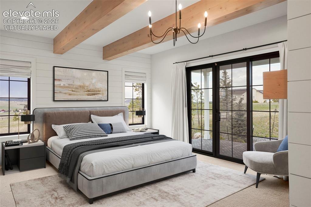 Image 18 of 49: Rich wooden beams and a warm gas fireplace anchor this spacious Primary bed