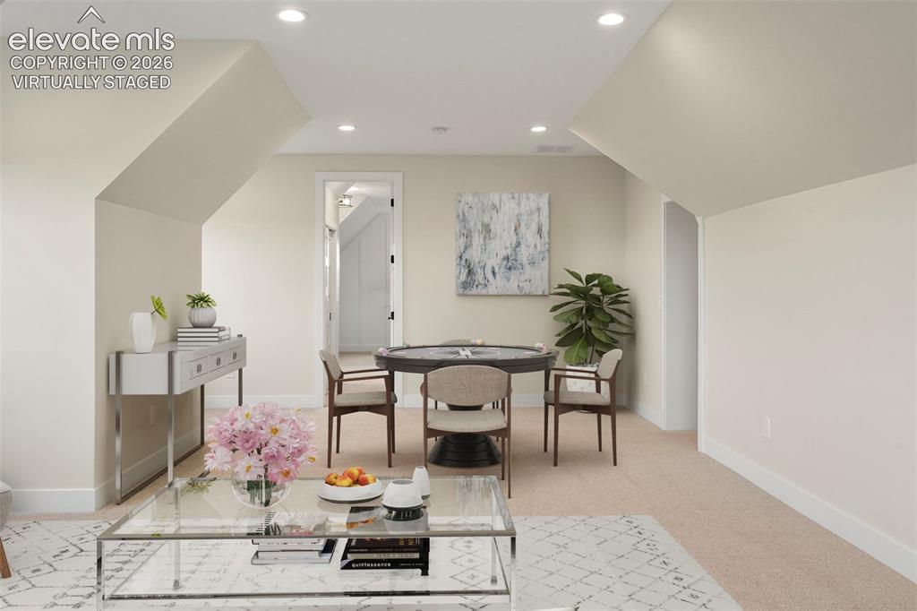 Image 30 of 49: Upstairs has an expansive family room with windows and lots of space to rel
