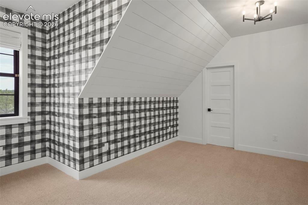 Image 37 of 49: Classic white tile and black accents are standard in all the bathrooms.