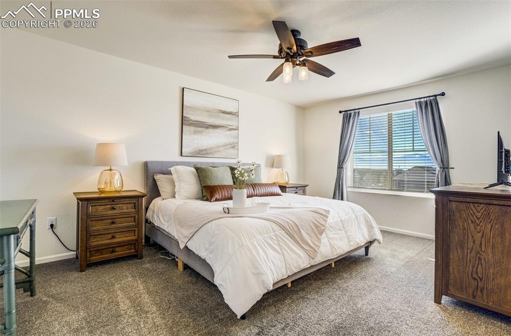 Image 15 of 42: Ceiling fan and space to unwind. 