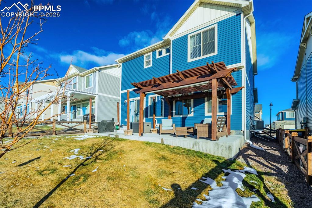 Image 38 of 42: Extended concrete patio for your year to shine on the grill. 