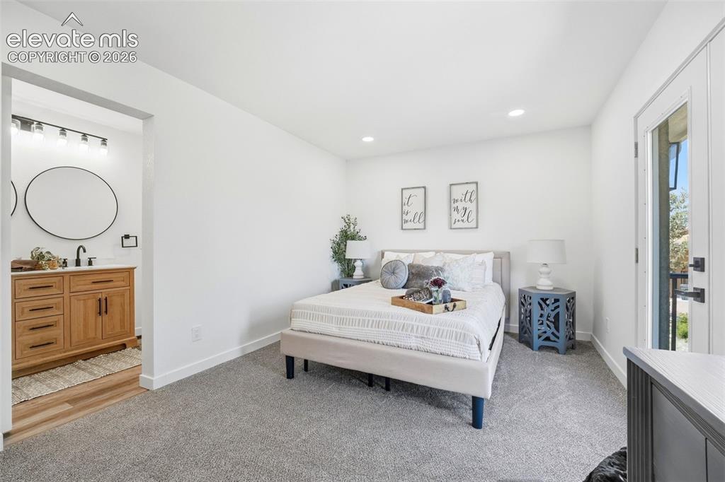 Image 10 of 36: Bedroom featuring light gray carpeting, recessed lighting, and white walls