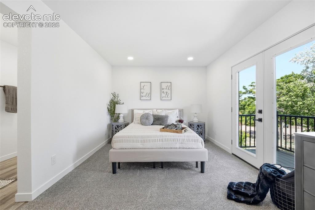 Image 11 of 36: Bedroom featuring white walls, recessed lighting, and grey carpeting