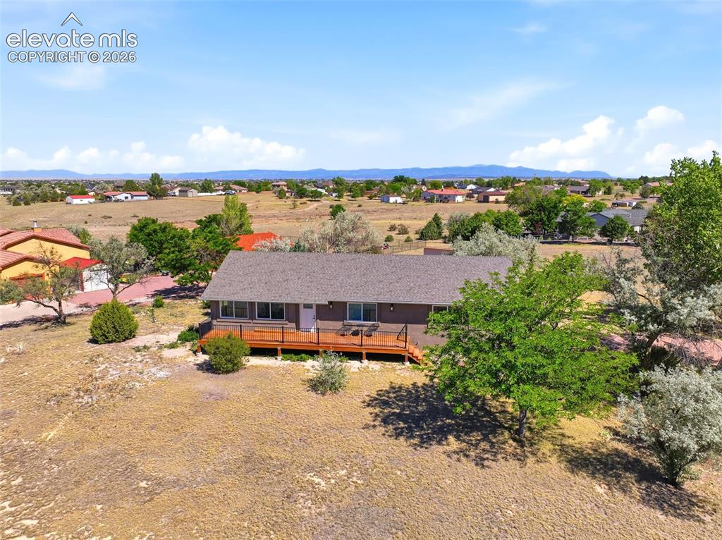Image 36 of 36: Ranch-style residence featuring a prominent front deck