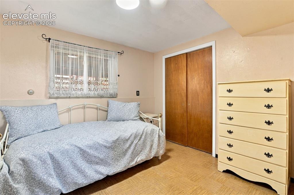 Image 24 of 42: Basement bedroom