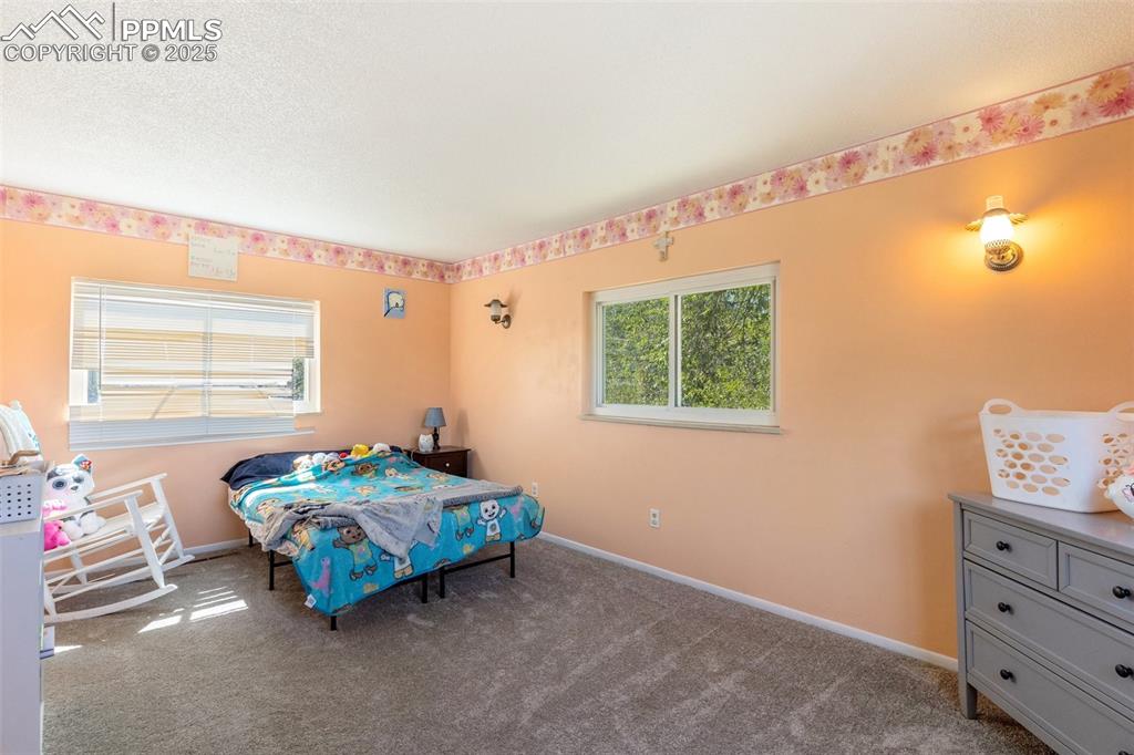 Image 7 of 14: Upper bedroom with carpet