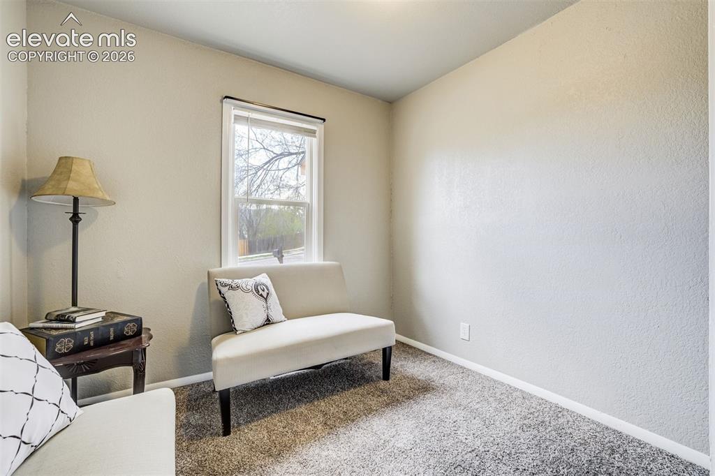 Image 28 of 46: Room featuring light neutral wall paint, white trim, a single window with b