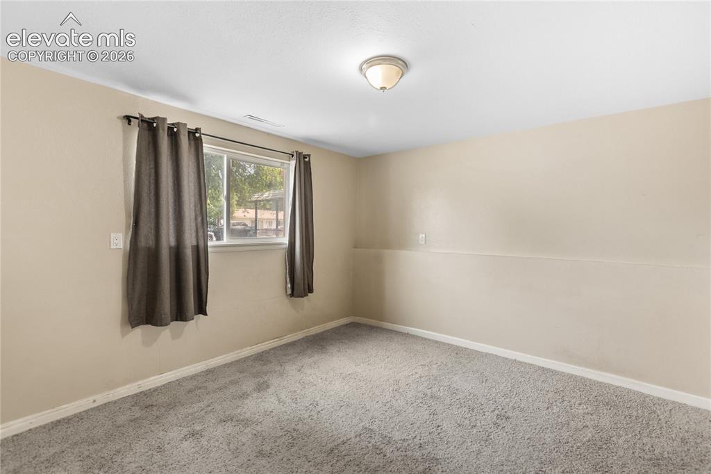 Image 15 of 23: Bedroom with window and closet