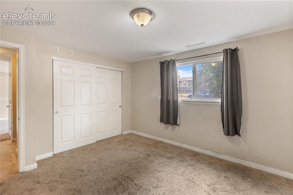 Image 16 of 23: Spacious bedroom with large closet