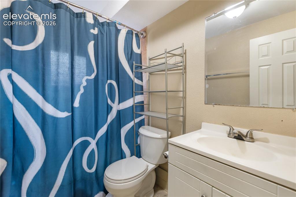 Image 19 of 23: Second full bathroom with updated vanity