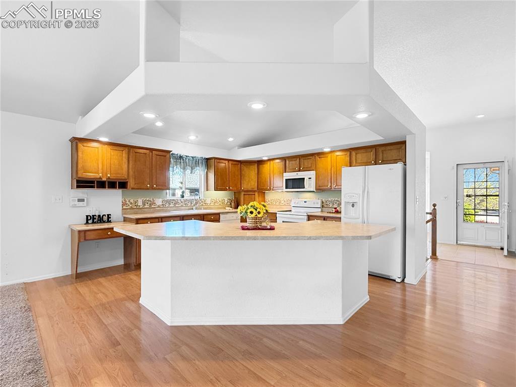 Image 10 of 46: Wide open kitchen with a great breakfast bar.