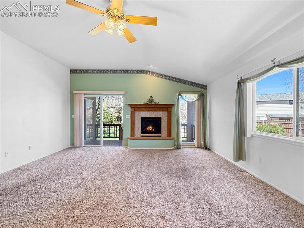 Image 16 of 46: Niced sized living room with an inviting gas fireplace.
