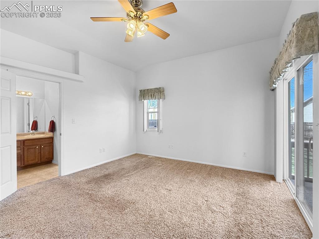 Image 19 of 46: Large primary suite with attached bath.