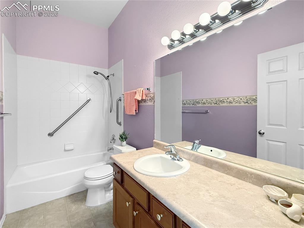 Image 25 of 46: Main level full bathroom.