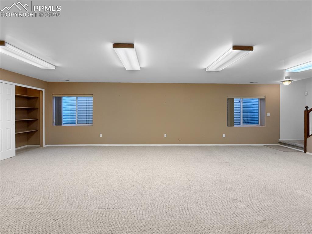 Image 29 of 46: Huge family/game room in basement.