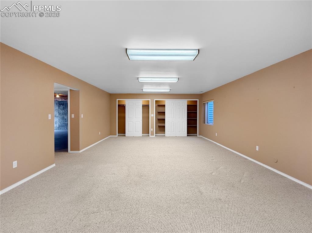 Image 31 of 46: Two huge closets in the family/game room.