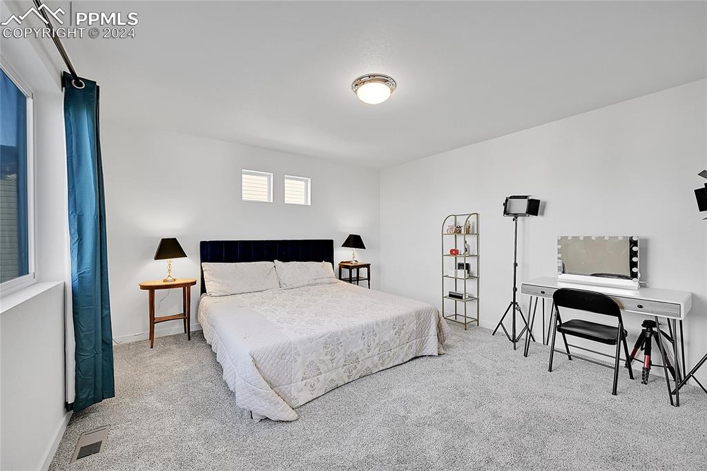 Image 25 of 42: Bedroom featuring carpet flooring