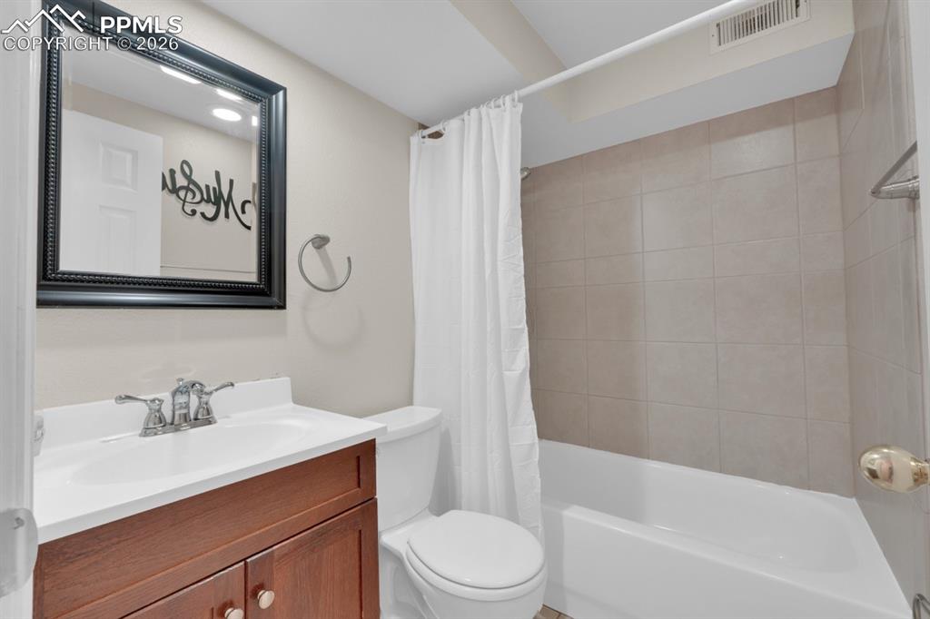 Image 31 of 49: Basement full hall bathroom