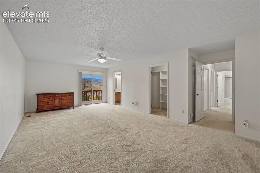 Image 10 of 40: Primary bedroom suite