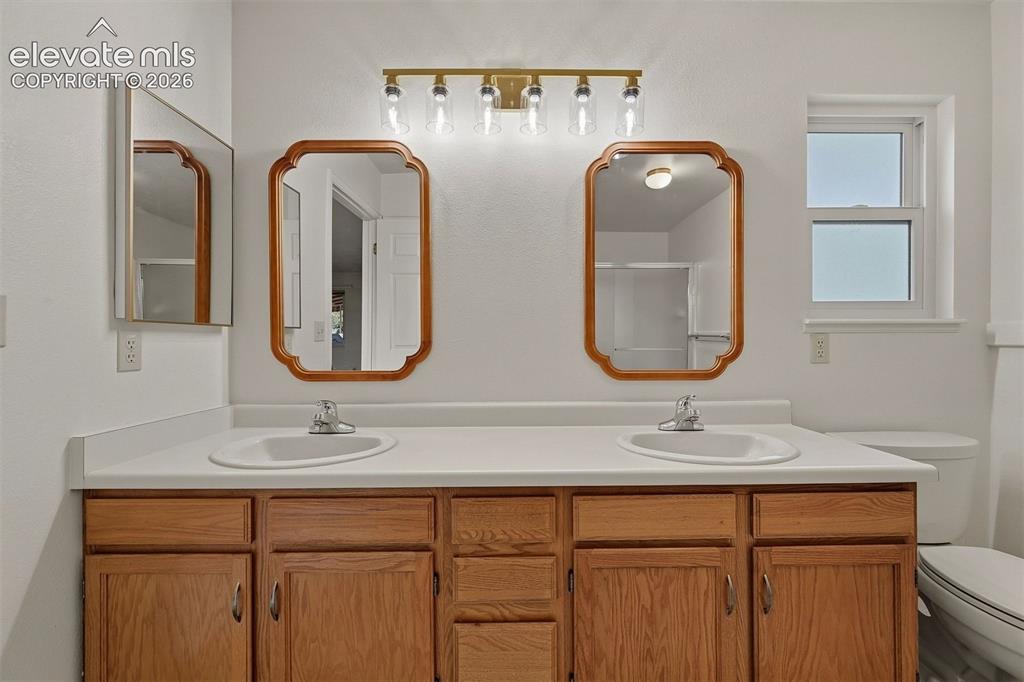 Image 12 of 40: Double vanities in primary 