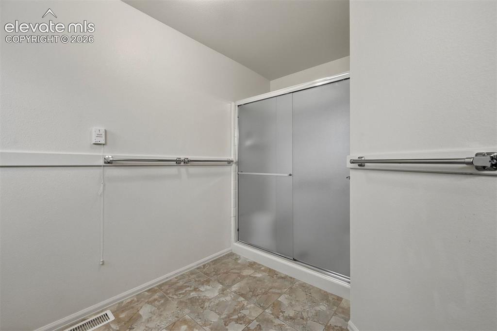Image 13 of 40: Wide spaces with an emphasis on accessibility in bath