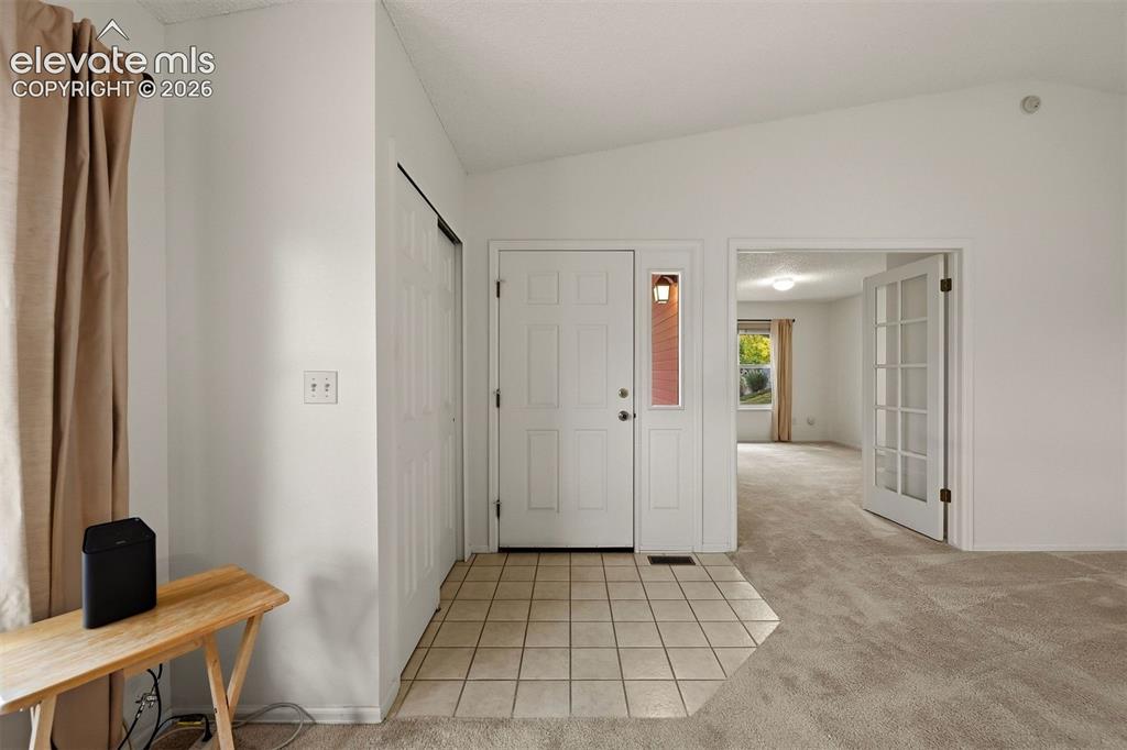 Image 20 of 40: Entry and fourth bedroom